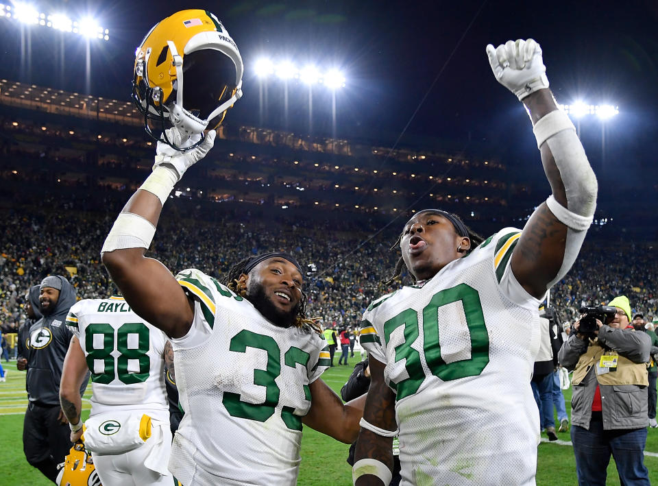 GREEN BAY, WISCONSIN - OCTOBER 14: Aaron Jones #33 and Jamaal Williams #30 of the Green Bay Packers celebrate the win against the Detroit Lions at Lambeau Field on October 14, 2019 in Green Bay, Wisconsin. (Photo by Quinn Harris/Getty Images)