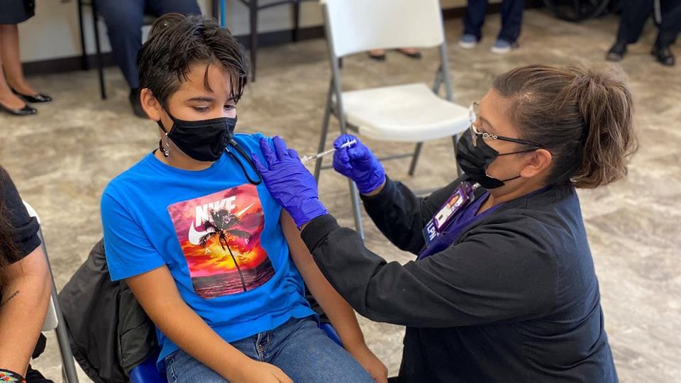 A healthcare worker administers a COVID-19 vaccine shot at the Anadarko Indian Health Center in Oklahoma in early November at an event featuring vaccines for children from 5 to 11.