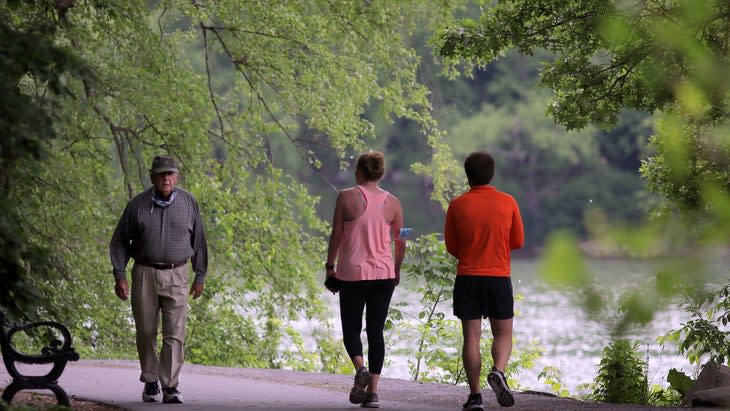 <span class="article__caption">Walking part of Boston’s Emerald Trail</span> (Photo: Boston Globe/Getty)