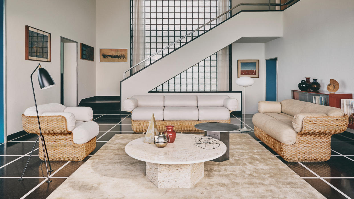  Travertine table in a living room by GUBI. 