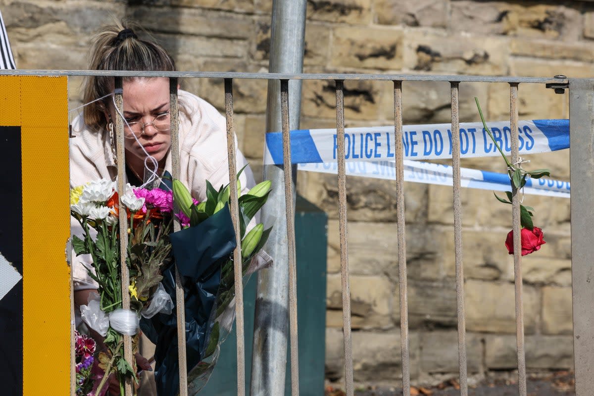 Floral tributes left near the scene in Woodhouse Hill, Huddersfield (Nigel Roddis/PA) (PA Wire)