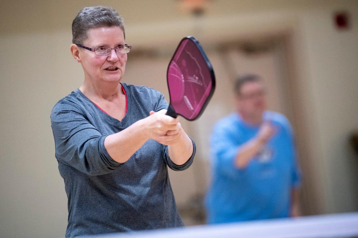 Julie Nidiffer gets into position during a game of pickleball at the Gordon Jewish Community Center in Nashville, Tenn., Wednesday, Dec. 19, 2018.