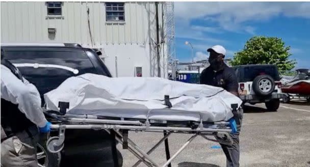 PHOTO: The body of a migrant who died after their vessel capsized off the coast of The Bahamas is taken away by mortuary workers in Nassau, Bahamas July 24, 2022. (ABC News)