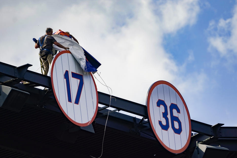 The jersey number of New York Mets announcer and former player Keith Hernandez is unveiled during a pre-game ceremony to retire his number before a baseball game between the Mets and Miami Marlins, Saturday, July 9, 2022, in New York. (AP Photo/John Minchillo)