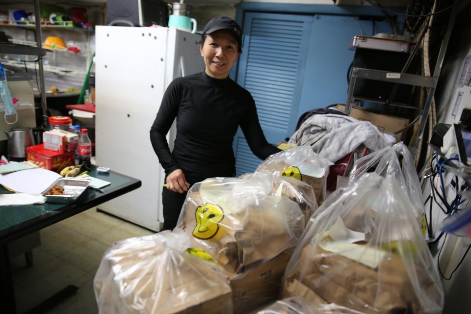 Joyce Cheng, owner of Harlan's Panda Garden, closed her doors to diners but has personally delivered food to the remote, sick and elderly. She stood before dozens of orders her family prepared before she finally decided to close, hoping to inspire more to shelter at home.