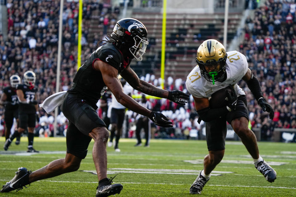 UCF's safety Nikai Martinez (21) catches and interception during the UC vs. UCF game at Nippert Stadium on Saturday November 4, 2023. UCF leads the game at halftime with a score of 14-10.