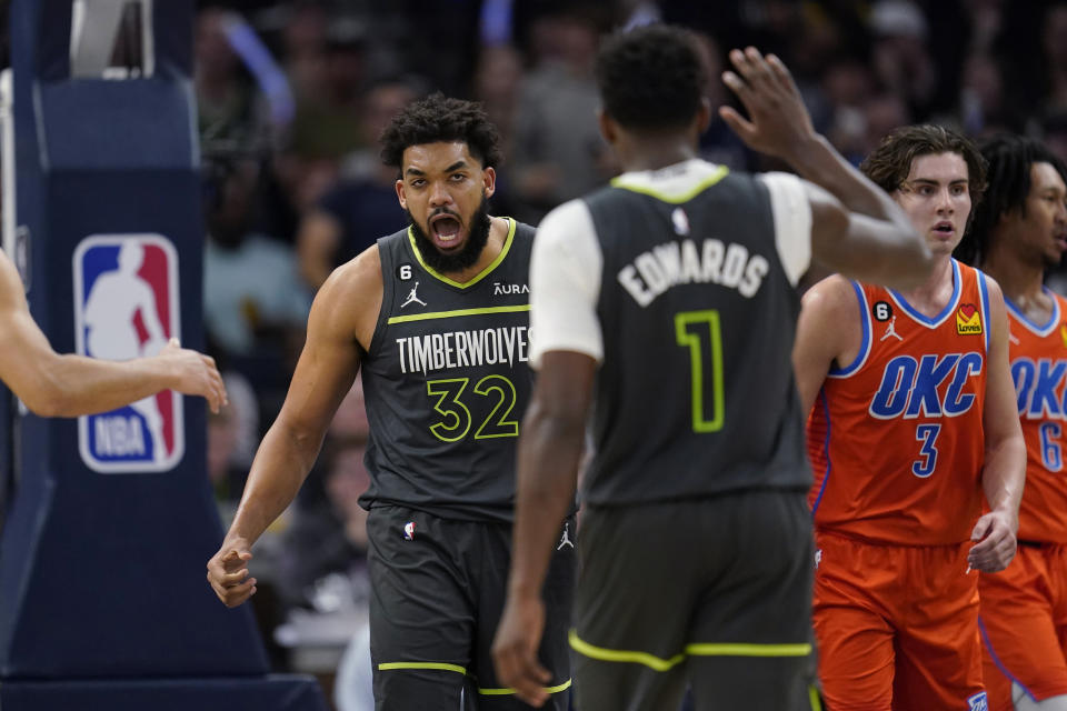 Minnesota Timberwolves center Karl-Anthony Towns (32) celebrates after making a basket during the second half of the team's NBA basketball play-in tournament game against the Oklahoma City Thunder, Friday, April 14, 2023, in Minneapolis. (AP Photo/Abbie Parr)