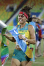 FILE - In this Aug. 19, 2016, file photo, Chloe Esposito of Australia crosses the finish line to win the gold medal in the women's modern pentathlon at the Summer Olympics in Rio de Janeiro, Brazil. Esposito announced in late January that a “wonderful, unexpected surprise” had occurred and that the Australian wouldn’t be able to defend her modern pentathlon gold medal at the Tokyo Olympics. She was pregnant with her first child. Two months later Esposito and thousands of other Olympic athletes learned that the Tokyo Games would be put off by a year until July 2021 because of the coronavirus pandemic. While for some it meant more time to recover from injuries or extra time to prepare, Esposito realized it might give her a second chance to be in Tokyo next year. (AP Photo/Natacha Pisarenko, File)