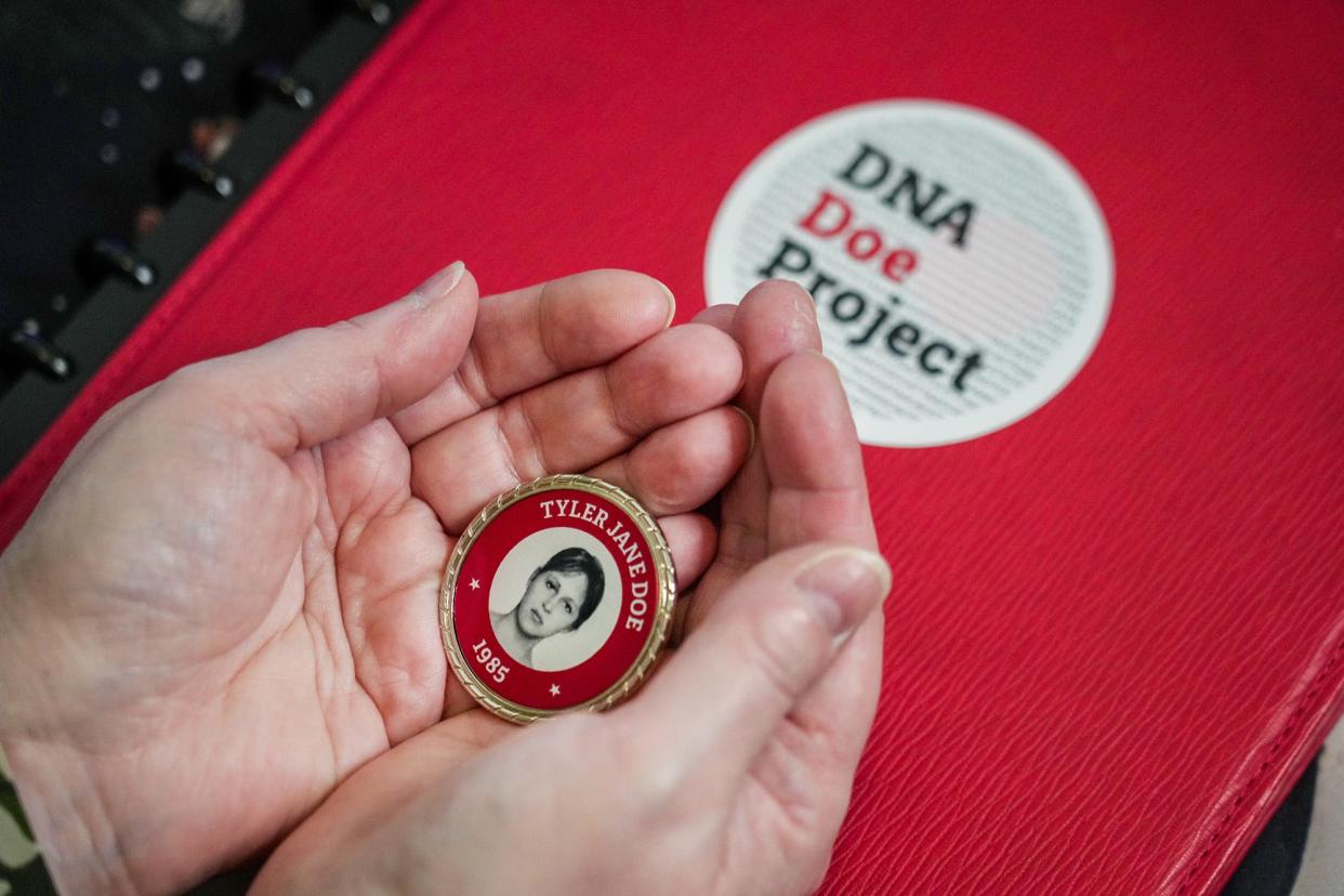 Rhonda Kevorkian holds a coin with the face of Sindy Gina Crow, an Arlington woman whose body was found in Smith County in 1985. The DNA Doe Project helped identify Crow this month.