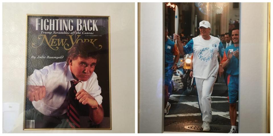 Photos of Trump on the cover of New York magazine and running with the Olympic torch hangs in a lobby bathroom at Mar-a-Lago in March 2017.