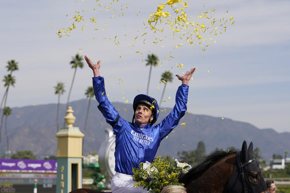 William Buick celebrates atop Master of the Seas after winning the Breeders' Cup Mile horse race Saturday, Nov. 4, 2023, at Santa Anita Park in Arcadia, Calif. (AP Photo/Ashley Landis)