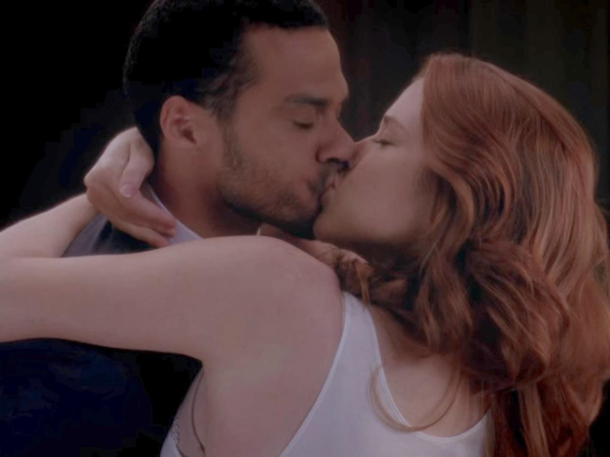 Jesse Williams and Sarah Drew kissing.