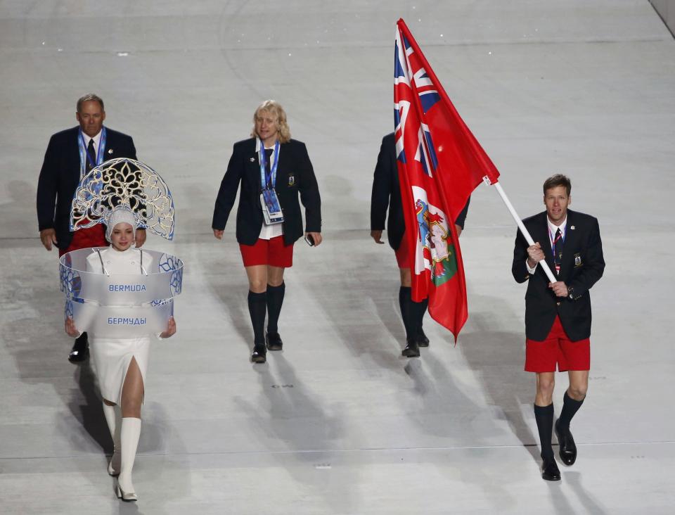 Bermuda's flag-bearer Tucker Murphy leads his country's contingent during the opening ceremony of the 2014 Sochi Winter Olympics, February 7, 2014. REUTERS/Lucy Nicholson (RUSSIA - Tags: OLYMPICS SPORT)