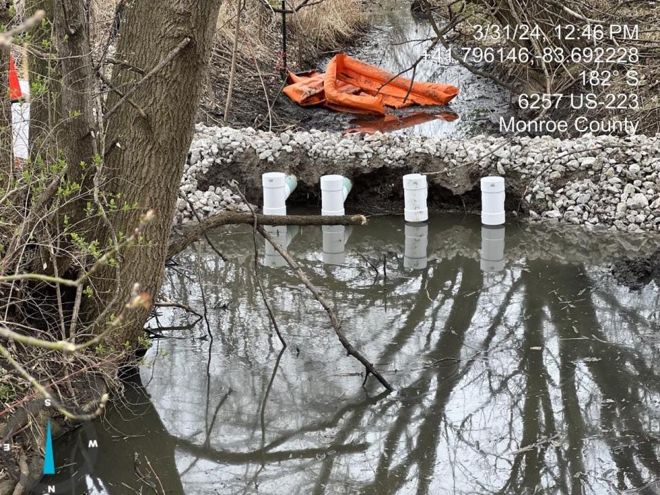 An overflow dam was installed to stop and contain the flow of diesel fuel further downstream.