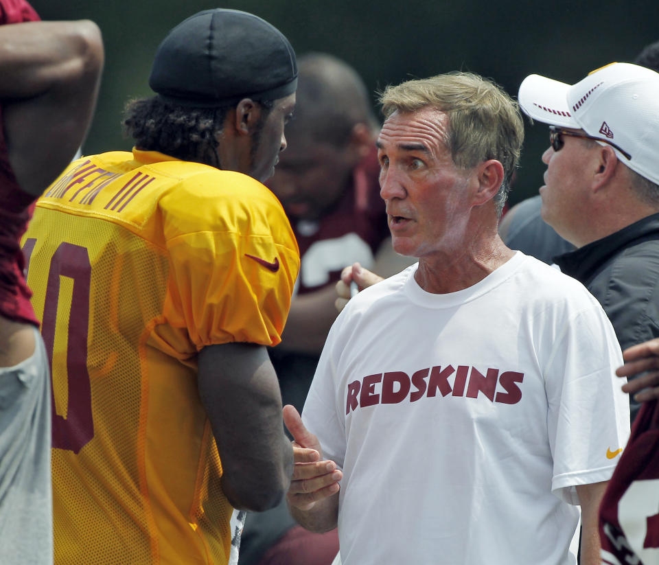 Mike Shanahan and Robert Griffin III during training camp in 2012. (AP)