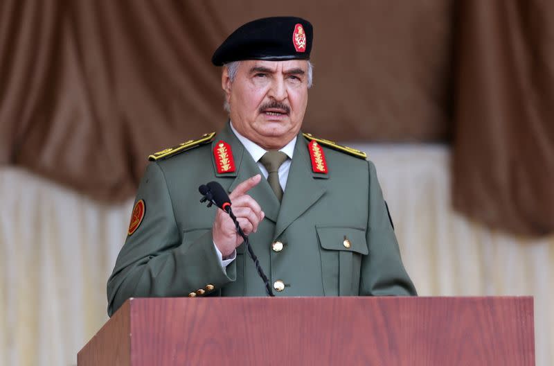 FILE PHOTO: Libyan military commander Khalifa Haftar gestures as he speaks during Independence Day celebrations in Benghazi