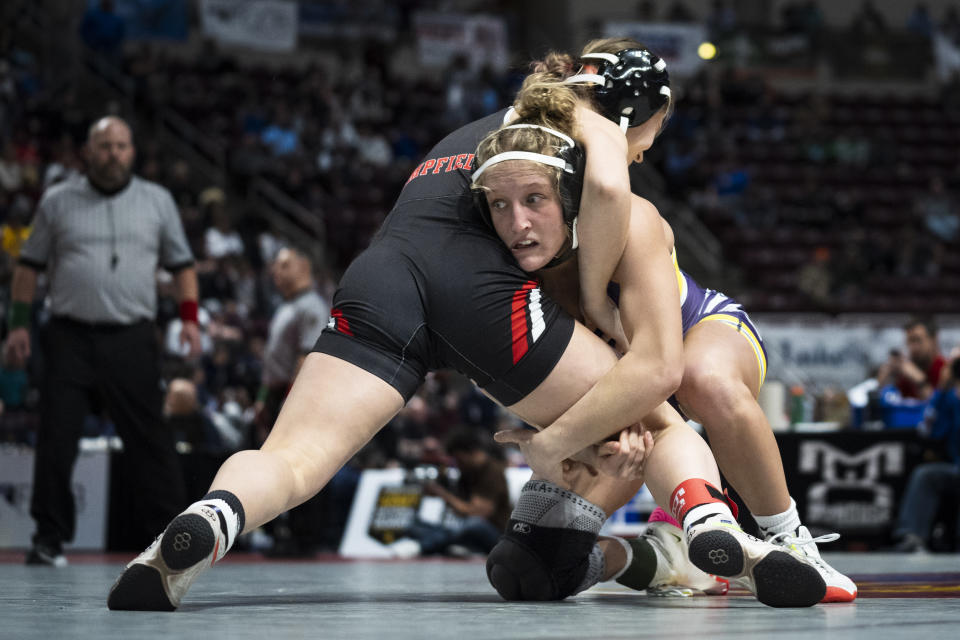 Palisades' Savannah Witt, right, wrestles Hempfield's Cleona O'Brien during the first found of the PIAA High School Wrestling Championships in Hershey, Pa., Thursday, March 7, 2024. Girls’ wrestling has become the fastest-growing high school sport in the country. (AP Photo/Matt Rourke)