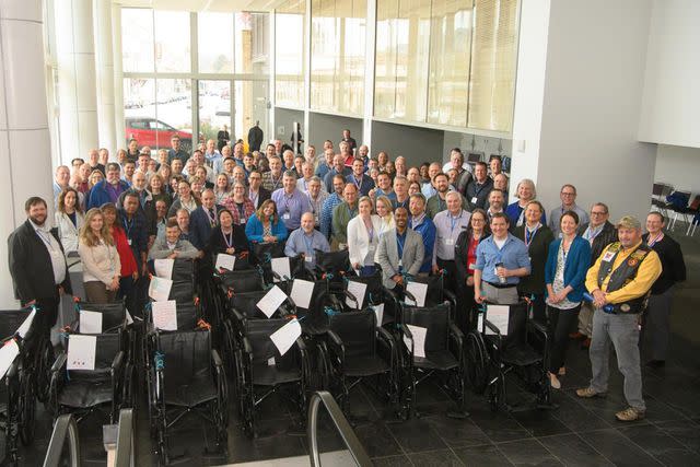 <p>Michael Troutman/www.dmtimaging.com</p> Stellar Solutions employees build wheelchairs for U.S. veterans at their annual business planning meeting.