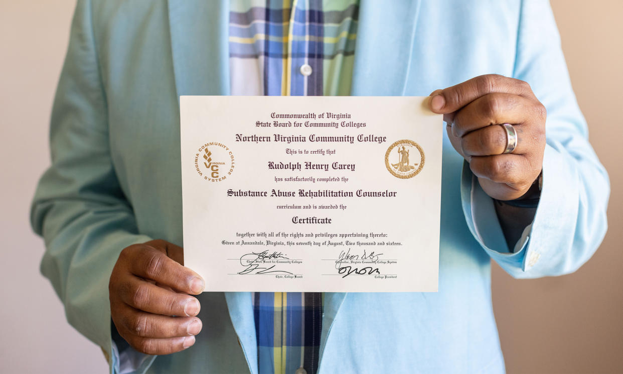 Image: Two hands holding a certificate issued by the Northern Virginia Community College. It reads,