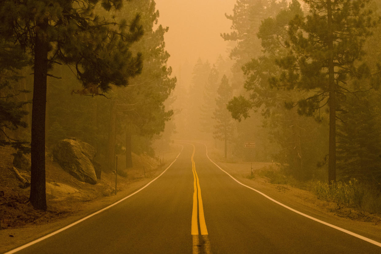 STRAWBERRY, CALIFORNIA, UNITED STATES - 2021/08/27: Smoke fills the air from the Caldor fire choking highway 50. 
The Caldor fire has grown to over 150,000 acres and threatens to grow to the Tahoe basin. The fire has reached the town of Strawberry. (Photo by Ty O'Neil/SOPA Images/LightRocket via Getty Images)