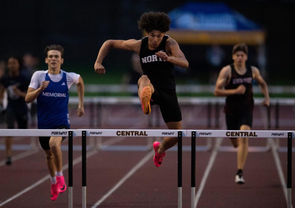 North’s Darian Walker leads in the 300 meter hurdles during the 2024 IHSAA Boys Track & Field Sectional 32 at Central High School Thursday, May 16, 2024.