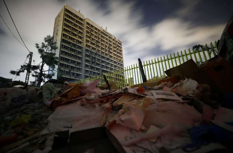 A view shows damage to a building surrounded by debris in the aftermath of a massive explosion at the port of Beirut