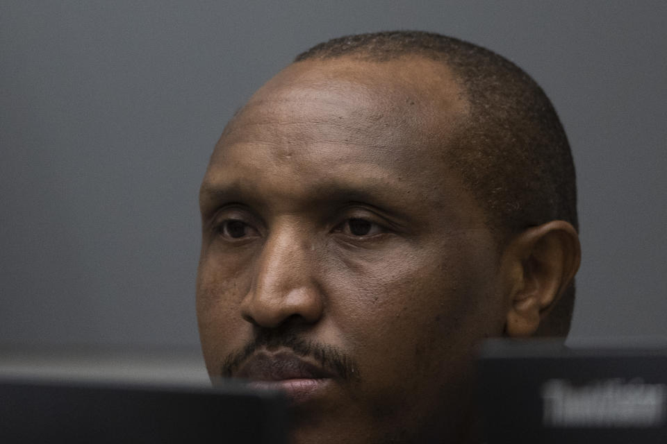 Congolese militia commander Bosco Ntaganda enters the courtroom of the International Criminal Court, or ICC, to hear the sentence in his trial in The Hague, Netherlands, Thursday, Nov. 7, 2019. The ICC delivered the sentence on Ntaganda, accused of overseeing the slaughter of civilians by his soldiers in the Democratic Republic of Congo in 2002 and 2003. (AP Photo/Peter Dejong, Pool)