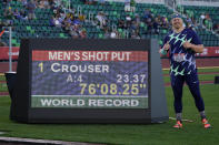 Ryan Crouser poses after setting a world record during the finals of men's shot put at the U.S. Olympic Track and Field Trials Friday, June 18, 2021, in Eugene, Ore. (AP Photo/Charlie Riedel)