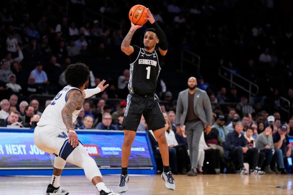 Georgetown's Primo Spears (1) shoots over Villanova's Cam Whitmore (22) in the second half of an NCAA college basketball game during the first round of the Big East conference tournament, Wednesday, March 8, 2023, in New York. (AP Photo/John Minchillo)