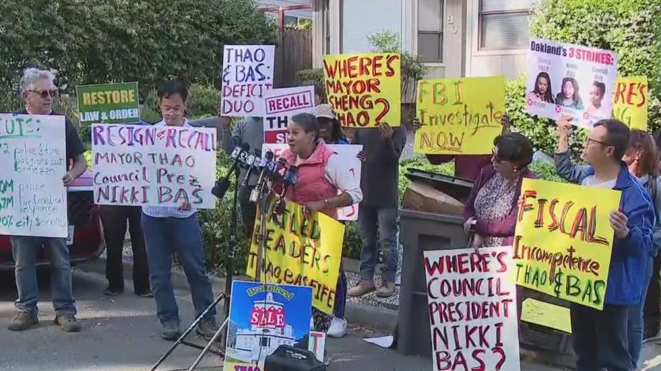 <div>Protesters stand outside Sheng Thao after the news of the FBI raid</div>