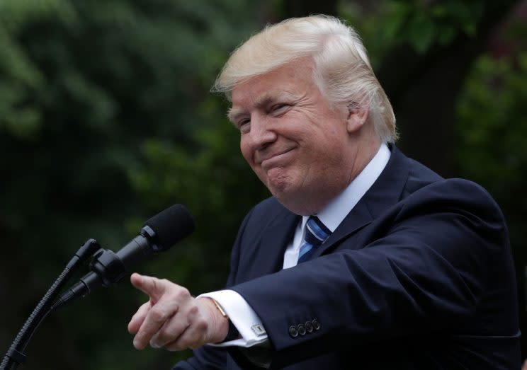 President Trump gestures as he speaks in the White House Rose Garden on Friday. 