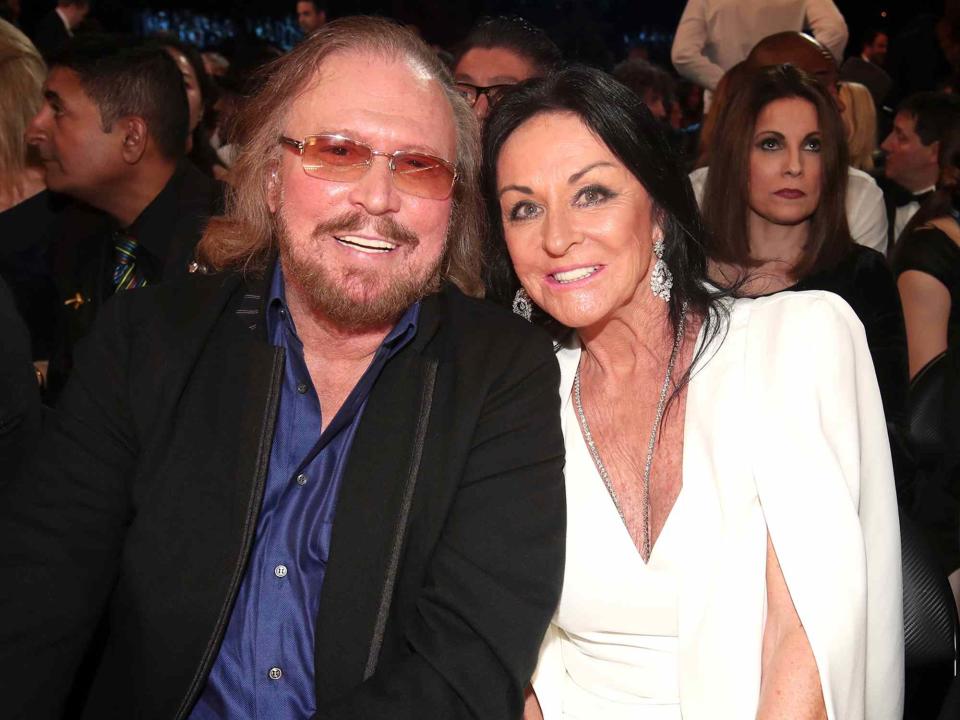 <p>Christopher Polk/Getty</p> Barry Gibb and Linda Gray Gibb during the 59th Grammy Awards in February 2017 in Los Angeles, California