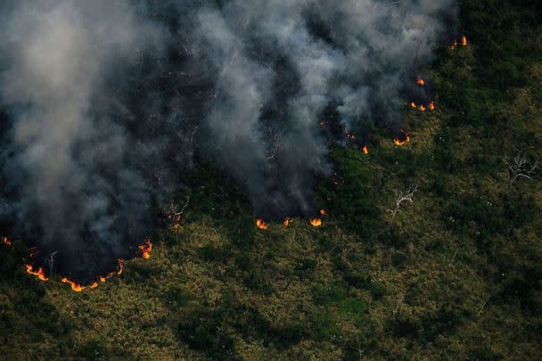 PHOTO: A handout aerial picture released by Greenpeace showing smoke billowing from a fire in the Amazon forest in the municipality of Porto Velho, Rondonia State, Brazil, July 27, 2022.  (GREENPEACE/AFP via Getty Images)