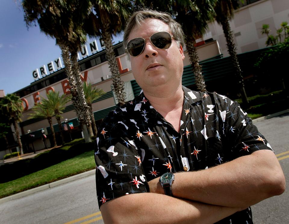 Author Tim Dorsey, who wrote many stories about the fictional serial killer Serge A. Storms, poses at the Derby Lane Greyhound Track in St. Petersburg, Fla. in 2007. The author of 26 published novels died Nov. 26 at age 62.