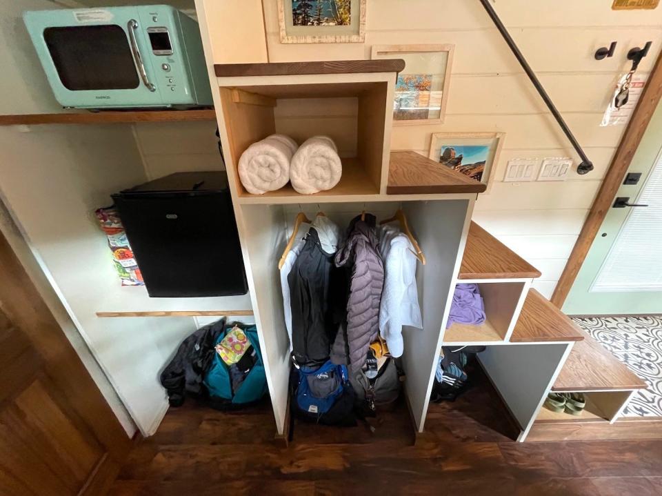 Storage cubbies underneath the staircase in the tiny house.