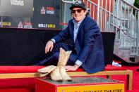 <p>Michael Madsen places his boots in the cement during his Hand and Footprint ceremony at the TCL Chinese Theatre in Hollywood on Monday. </p>