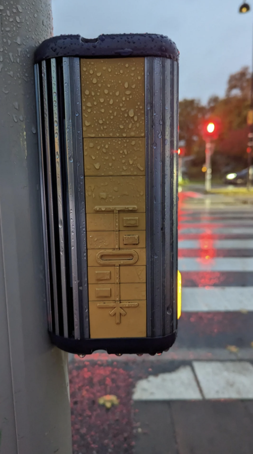 a crosswalk sign for blind pedestrians