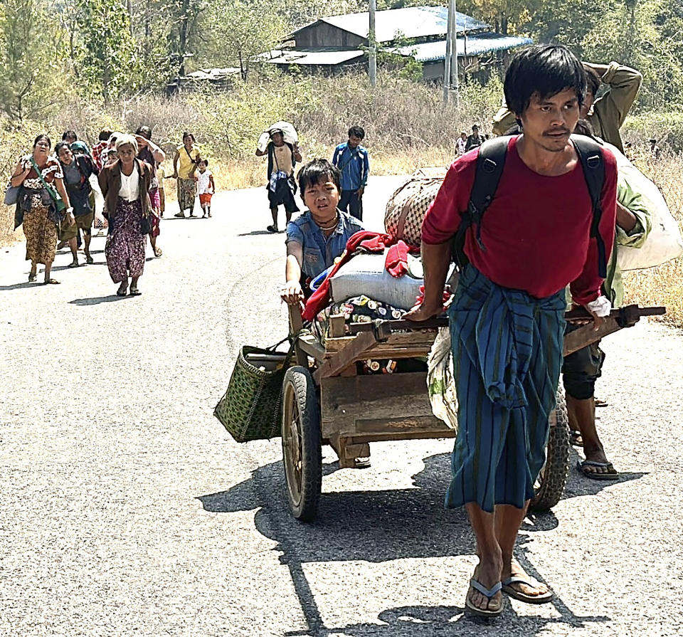 In this photo released by the Free Burma Rangers, people flee Myanmar military in Pasaung, Karenni state, Myanmar on March 1, 2024. (Free Burma Rangers via AP)