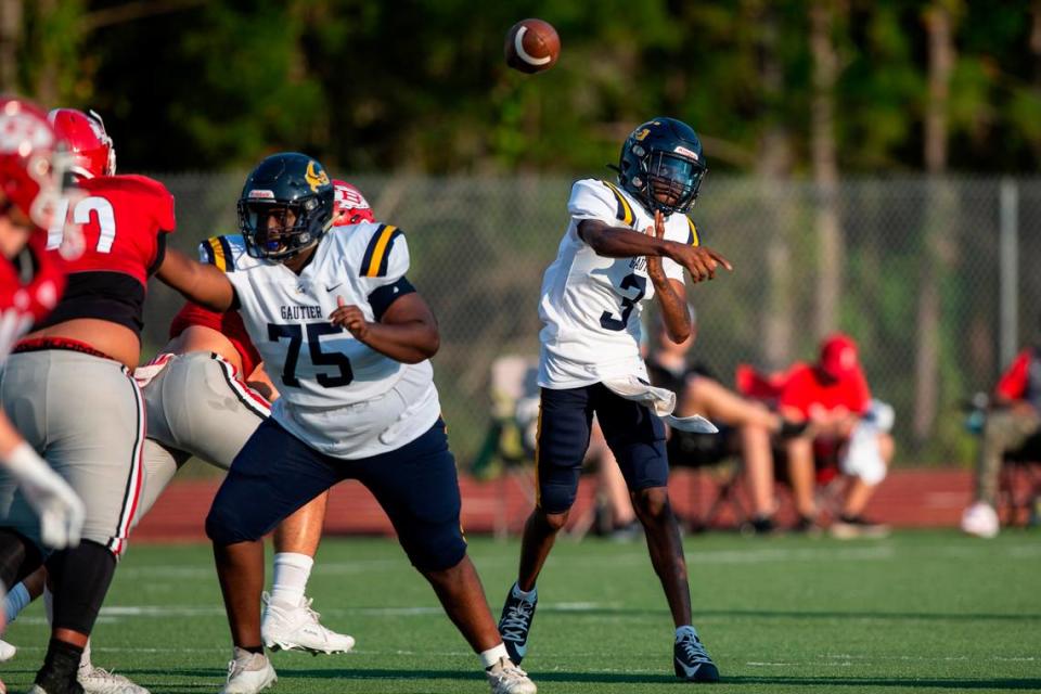 Gautier quarterback Trey Irving throws a pass during a Jamboree game at Biloxi High School on Friday, Aug. 18, 2023.