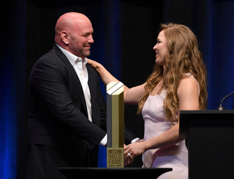 UFC president Dana White (L) greets Ronda Rousey onstage as she becomes the first female inducted into the UFC Hall of Fame at The Pearl concert theater at Palms Casino Resort on July 5, 2018 in Las Vegas, Nevada. (Getty Images)