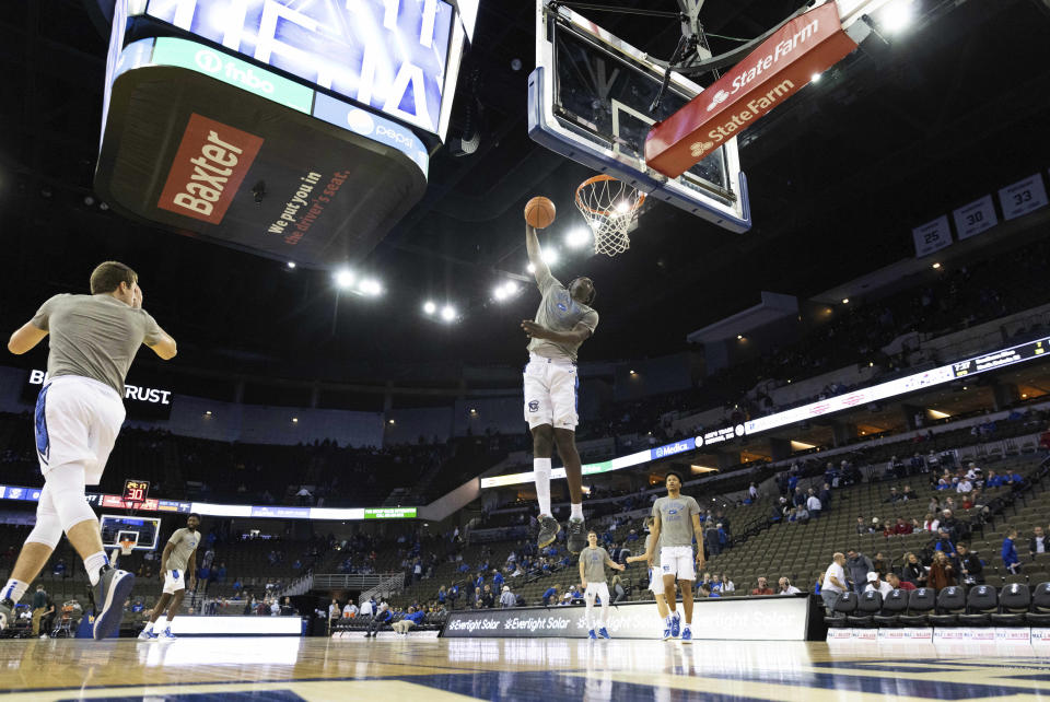 Creighton's Arthur Kaluma leaps for a shot while warming up before playing Iowa State in an NCAA college basketball game Saturday, Dec. 4, 2021, at CHI Health Center in Omaha, Neb. (AP Photo/Rebecca S. Gratz)