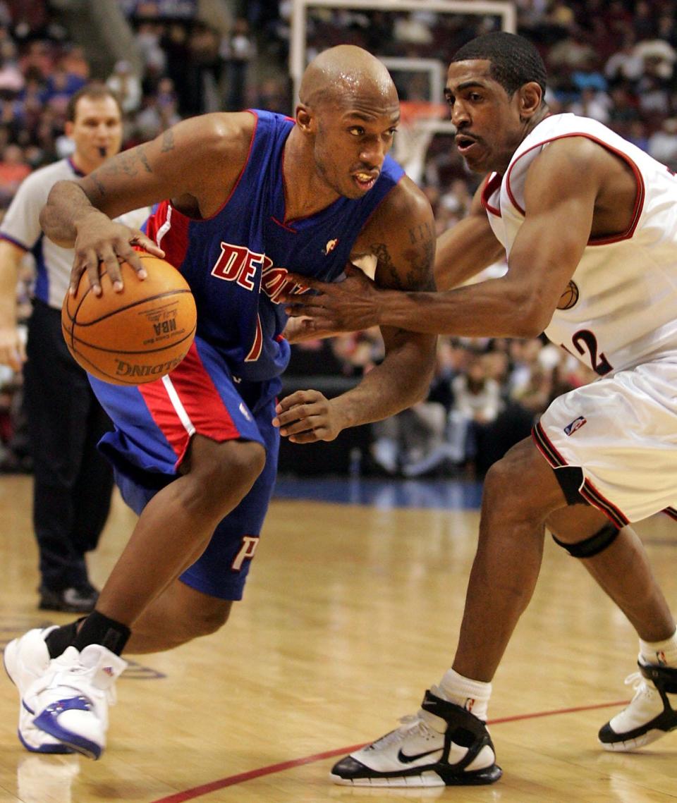 Detroit Pistons' Chauncey Billups drives past Philadelphia 76ers' Kevin Ollie, Feb. 3, 2006, in Philadelphia.