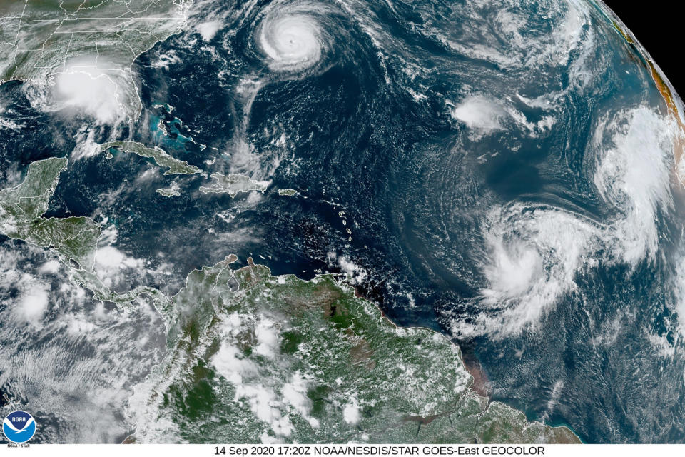 This satellite image provided by the NOAA shows five tropical cyclones churning in the Atlantic basin at 5:20 p.m. GMT on Monday, Sept. 14, 2020. The storms, from left, are Hurricane Sally over the Gulf of Mexico, Hurricane Paulette over Bermuda, the remnants of Tropical Storm Rene, and Tropical Storms Teddy and Vicky. / Credit: AP