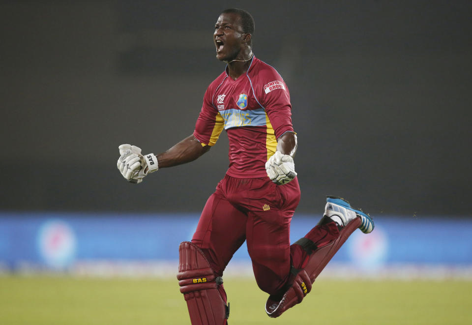 West Indies' captain Darren Sammy runs to celebrate his team's win over Australia in the ICC Twenty20 Cricket World Cup match in Dhaka, Bangladesh, Friday, March 28, 2014. West Indies' won the match by six wickets. (AP Photo/Aijaz Rahi)