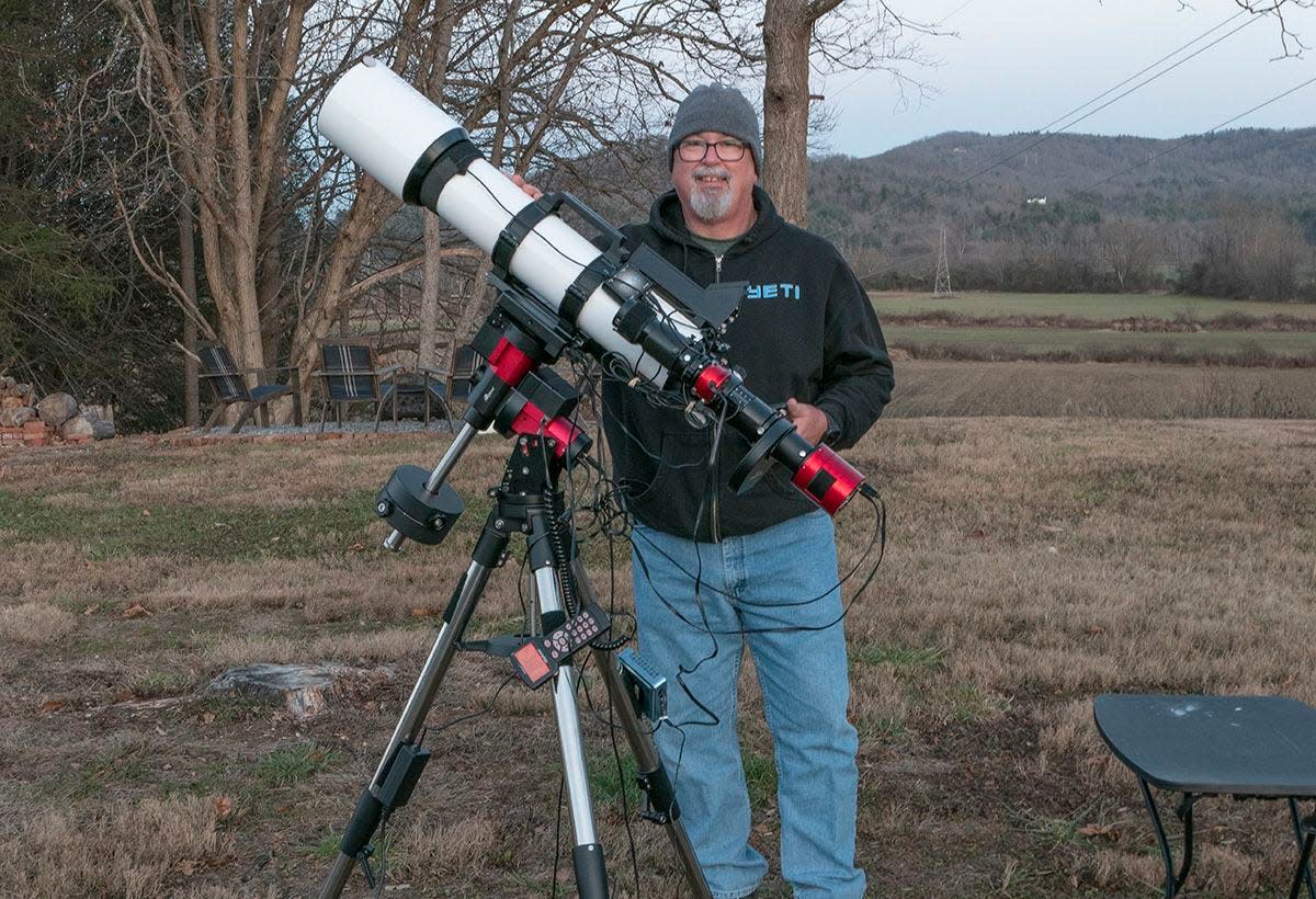 Brevard astronomer David Johnston poses with his imaging telescope. He was recently named a NASA Solar System Ambassador.