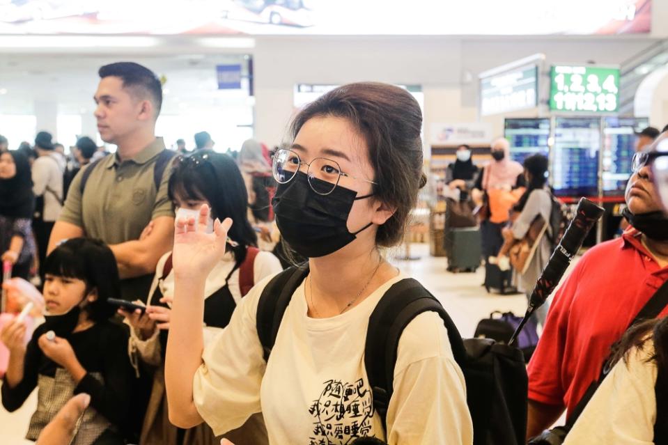 Eunice Ang speaks to Malay Mail as she queues to get her QR code. — Picture by Sayuti Zainudin