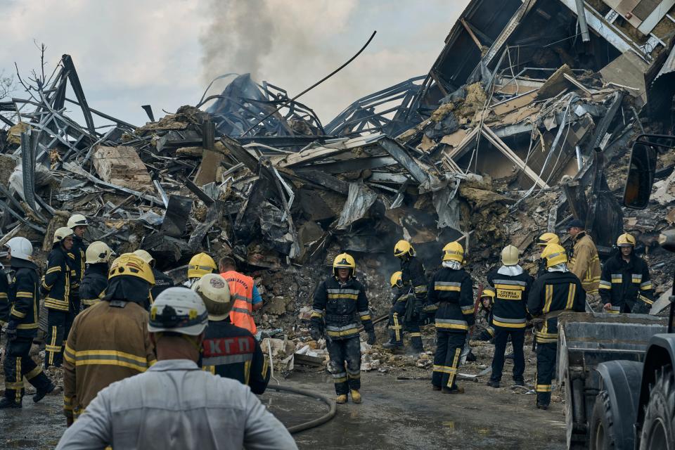 Emergency service personnel work at the site of a destroyed building after a Russian attack in Odesa, Ukraine, Thursday, July 20, 2023.