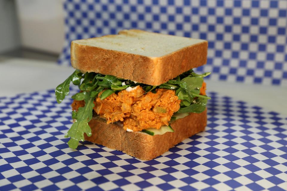 The Buffalo Chickpea sandwich with vegan mayo, cucumber and arugula on thick white bread, one of the vegan options at Benny's Brown Bag in Peekskill, Sept. 1, 2023.