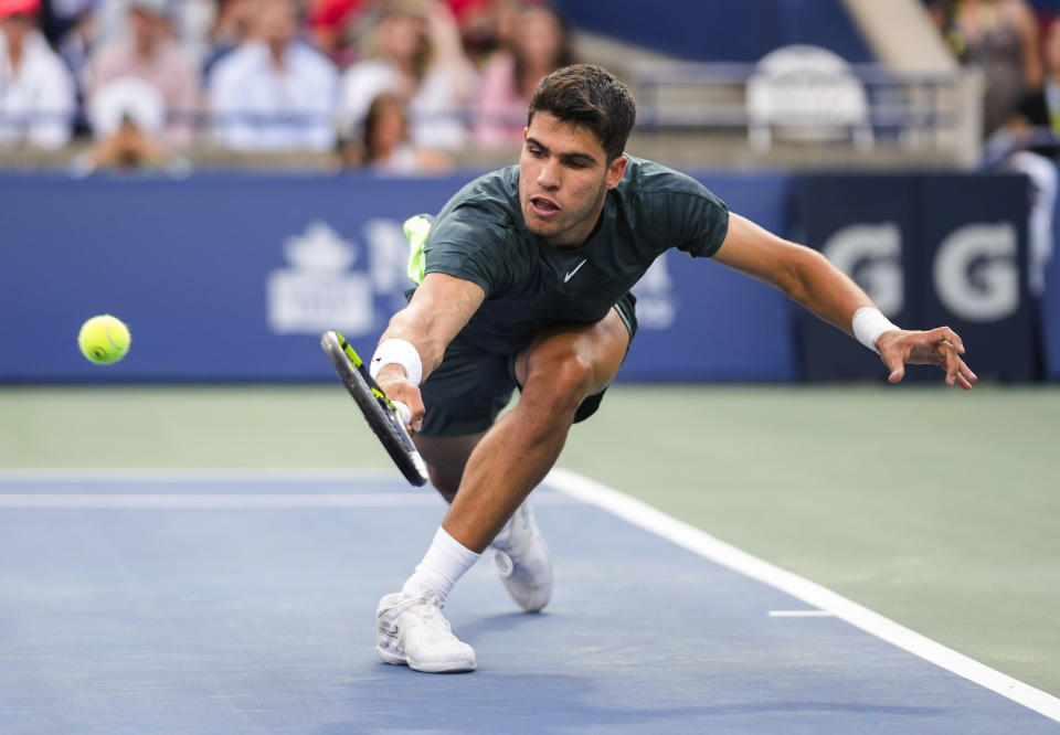 Spain's Carlos Alcaraz reaches for a shot from United States' Ben Shelton during the National Bank Open men’s tennis tournament Wednesday, Aug. 9, 2023, in Toronto. (Mark Blinch/The Canadian Press via AP)