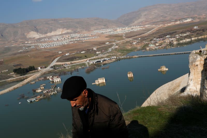 Ridvan Ayhan, an activist and a former resident, strolls in a part of the old town that will remain above the dam lake in Hasankeyf in southeastern Batman province